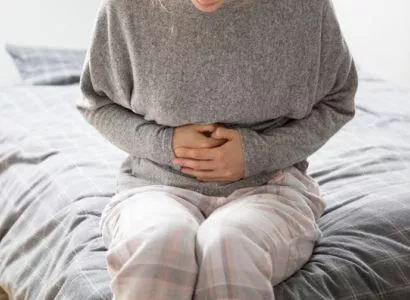 sick-woman-with-hands-on-stomach-suffering-from-intense-pain_1262-18659 1.jpg